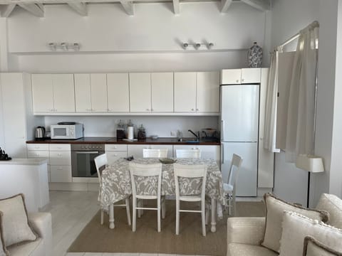 Villa | Private kitchen | Fridge, microwave, oven, cookware/dishes/utensils