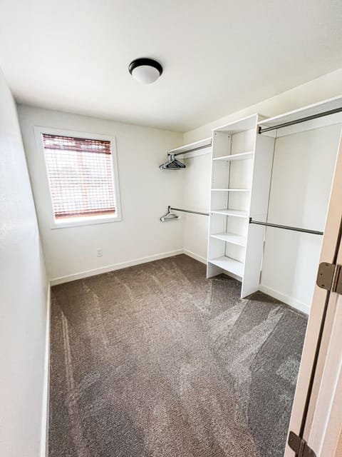 primary closet with room to set up a pack-n-play if kids need to be near primary