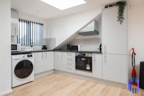 Kitchen. Fully equipped with cooking equipment perfect for families. Appliances such as fridge freezer, microwave, cooker, oven, dishwasher Toaster are free and available for your use.