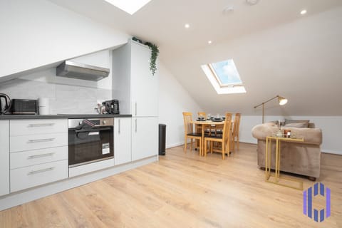 Kitchen. Fully equipped with cooking equipment perfect for families. Appliances such as fridge freezer, microwave, cooker, oven, dishwasher Toaster are free and available for your use.