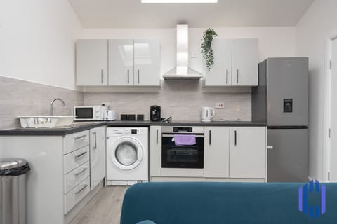 Kitchen. Fully equipped with cooking equipment perfect for families. Appliances such as fridge freezer, microwave, cooker, oven, dishwasher Toaster are free and available for your use.