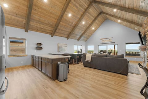 This grand living room boasts of vaulted ceilings and lots of room!
