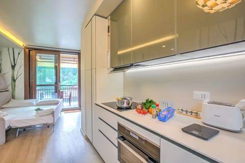 Luxury Apartment, 1 Bedroom (Il Mughetto Campo Smith On The Ski) | Private kitchen | Fridge, microwave, oven, stovetop