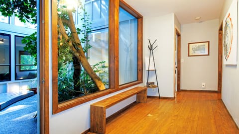 Primary bedroom @ the end of the hallway to the left, 1/2 bathroom to the right.