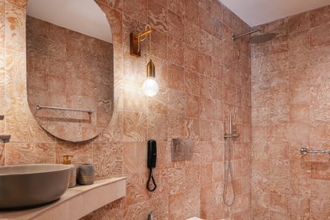 Junior Suite, Ground Floor | Bathroom | Shower, hair dryer, bathrobes, slippers