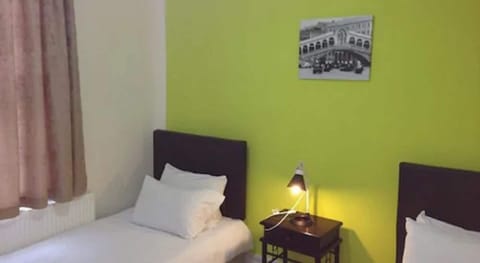 Economy Twin Room | 1 bedroom, in-room safe, iron/ironing board, free WiFi