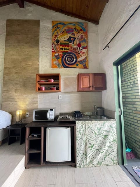 Premium Studio | Private kitchen | Fridge, microwave, cookware/dishes/utensils, dining tables