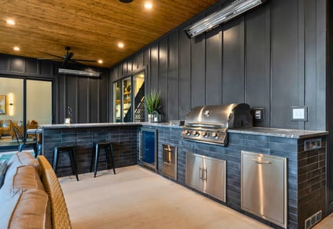 Enjoy the best of both worlds with our outdoor kitchen, combining modern appliances with the beauty of outdoor dining.