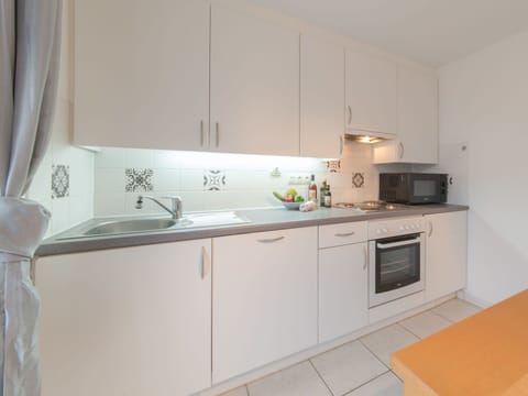 Sky, Cloud, Plant, Property, Window, Building, Mountain, Highland, Wood, Tree