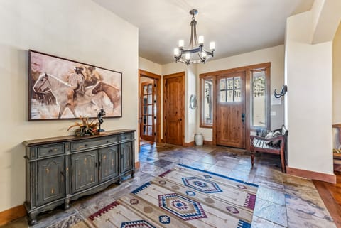 Entryway: Bench, coat rack, spacious area with ample storage space, half bath