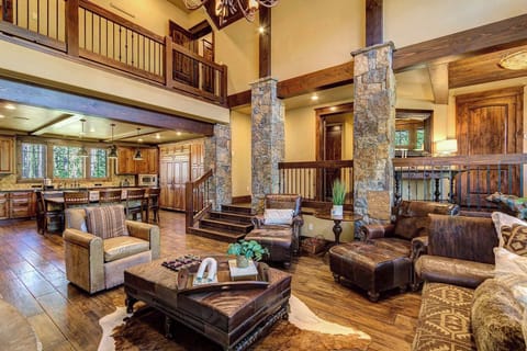 Living Room: Couch, 3 chairs, gas fireplace, open layout with kitchen and private dining area