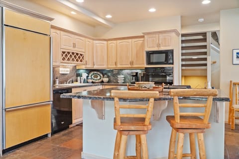 Kitchen: Drip coffee maker, Keurig, Crockpot, cooking utensils, tableware