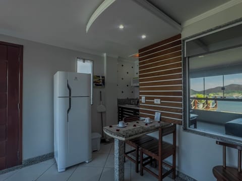 Deluxe Apartment, Sea View | Private kitchen | Microwave, coffee/tea maker, blender, cookware/dishes/utensils