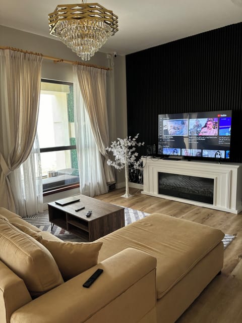 65-inch Smart TV with satellite channels, video-game console, Netflix