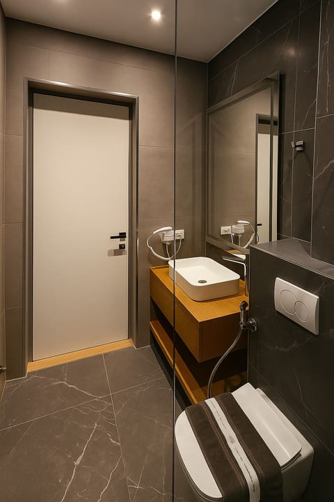 Suite | Bathroom | Hair dryer, children's robes, bidet, towels