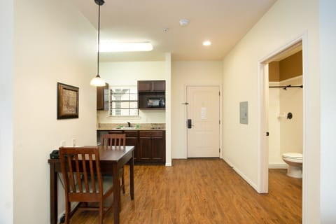 Studio Suite | Private kitchen | Full-size fridge, microwave, stovetop, cookware/dishes/utensils