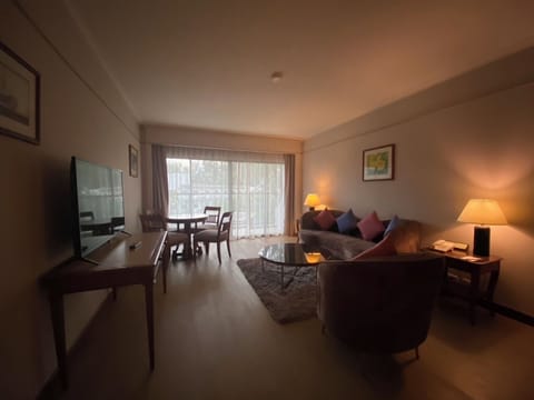 1Bedroom Casuarina Suite | Living area | 49-inch LED TV with satellite channels, TV