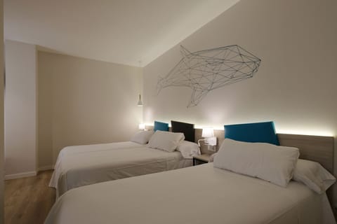 Triple Room | Memory foam beds, minibar, in-room safe, individually decorated