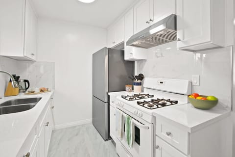 Stovetop, oven, coffee maker, and all the utensils you need for delicious meals.