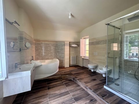 Suite, River View | Bathroom | Hair dryer, slippers, towels, soap