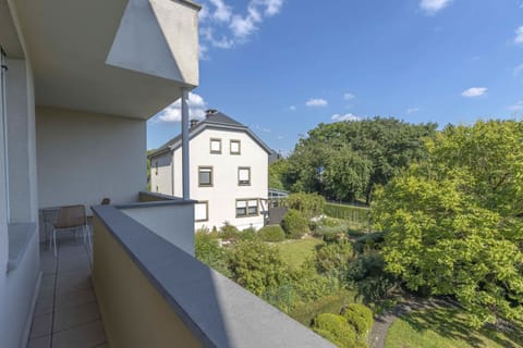 Enjoy stunning views of the lush green surroundings from your private balcony. A perfect spot for morning coffee or evening relaxation in the heart of Bonnevoie-Nord, Luxembourg.