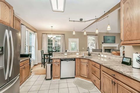 Chef's kitchen with granite countertops and gas stove/oven