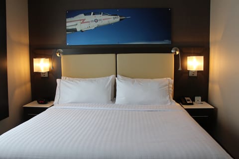 Premium bedding, down comforters, pillowtop beds, in-room safe