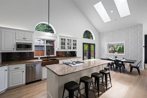 Large kitchen island with 6 bar stools, dishwasher, micro, air fryer, toaster. 
