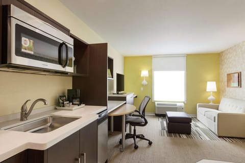 Suite, 1 King Bed, Non Smoking | Premium bedding, desk, laptop workspace, iron/ironing board