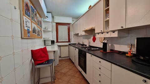 Cozy and fully equipped kitchen, part of a large apartment close to the sea.