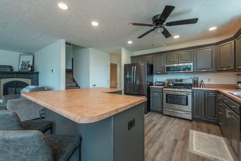 Well-equipped kitchen with gas range, dishwasher, and coffee bar with standard, drip-style coffee maker and Keurig