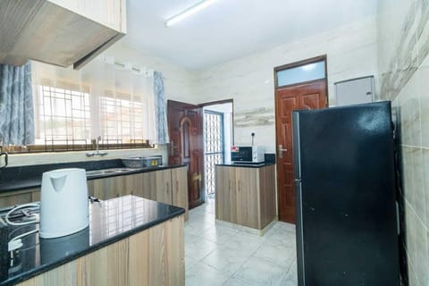 Family Villa | Private kitchen | Fridge, microwave, cookware/dishes/utensils, dining tables