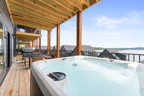Relax on the deck with stunning lake views while enjoying the private hot tub or barrel sauna.