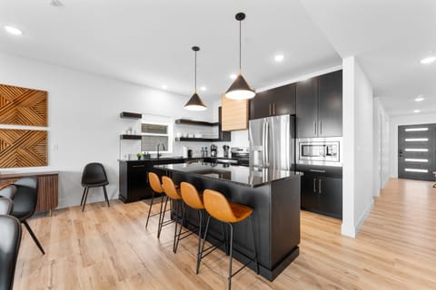 The open-concept kitchen is fully stocked and ideal for group meals.