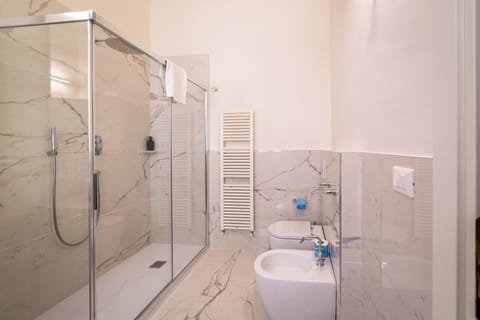 Quadruple Room | Bathroom | Shower, hair dryer, towels, soap