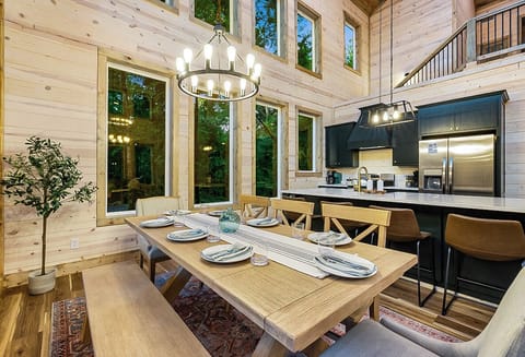 Dining Table seats 8 with benches and chars, plus 4 bar stools in the kitchen