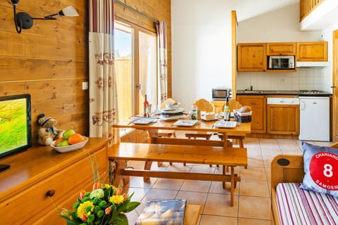 Prepare meals in the kitchenette and enjoy them at the dining table.