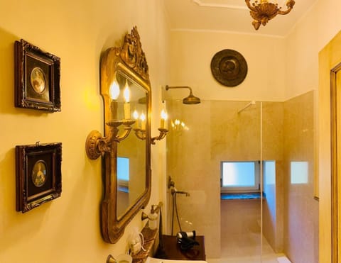 Luxury Double Room, Courtyard View | Bathroom | Shower, hair dryer, bathrobes, slippers