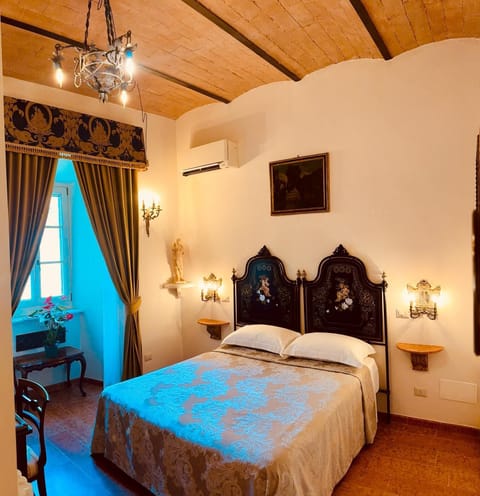 Luxury Double Room, Courtyard View | In-room safe, desk, laptop workspace, blackout drapes