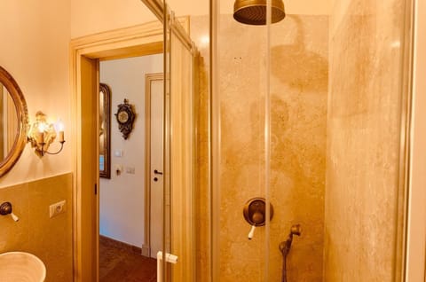 Luxury Double Room, Courtyard View | Bathroom | Shower, hair dryer, bathrobes, slippers