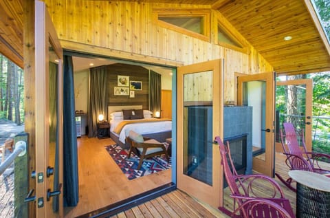 Relax on a charming porch that seamlessly blends indoor comfort with outdoor beauty.