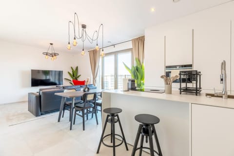 Dining area seamlessly connected to the kitchen, creating a versatile and welcoming space.