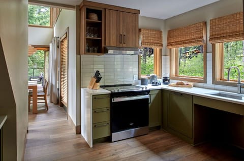 Fully equipped kitchen with modern appliances and scenic views, perfect for culinary adventures.