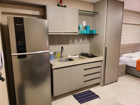 Premium Studio, Pool View | Private kitchen | Fridge, microwave, stovetop, toaster