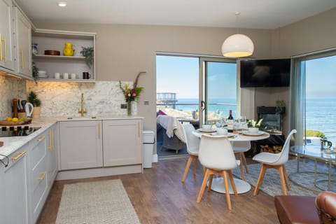 Kitchen/dining areas with doors leading to the balcony