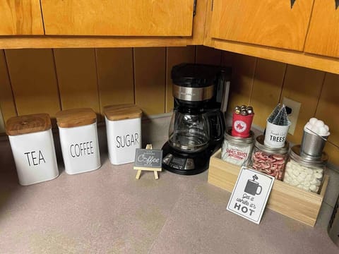 Kitchen - drip coffee machine, complimentary grounded coffee, and tea bags