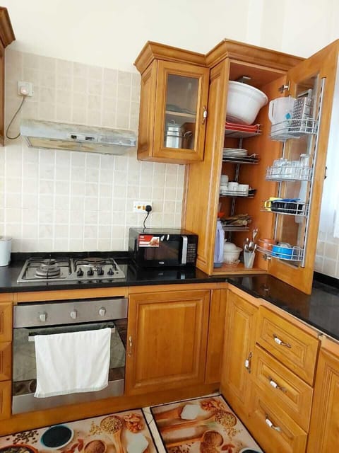 Classic Apartment | Private kitchen | Fridge, cookware/dishes/utensils, dining tables