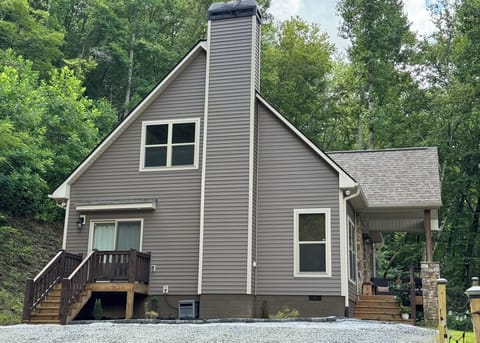 Side View, Open Entry Deck, Covered Front Entry and Plenty of Parking.