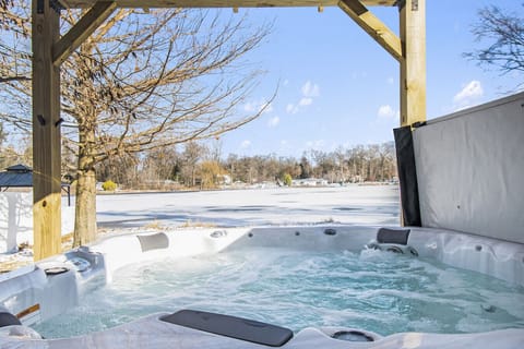Soak in the hot tub while surrounded by serene winter beauty—perfect for relaxation after a day of fun.