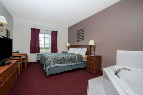 Suite, 1 King Bed, Non Smoking | Blackout drapes, iron/ironing board, free WiFi, bed sheets
